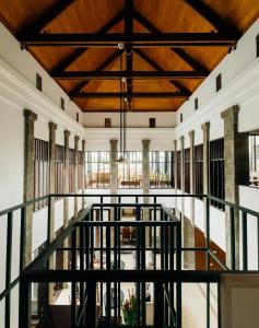 a view of the lobby of a building with a wooden ceiling at Umpadhi Canggu in Canggu