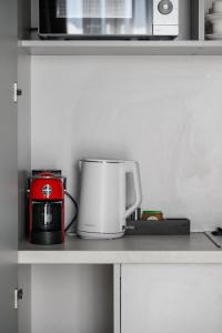 a coffee maker and a toaster on a kitchen counter at MM GROUP APARTMENT Dastor in Uzhhorod +17 photos