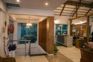 a lobby of a restaurant with a counter and a window at Chill Berg Resort - Bodimettu in Theni