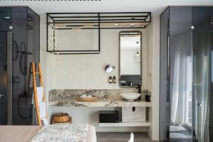a bathroom with a sink and a mirror at K Studios in Faliraki