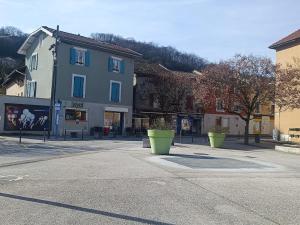 a street in a town with a building at Studio Cardinal in Renage