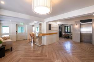 a living room with a couch and a table at Maestro St Lazar Apartments in Larnaca