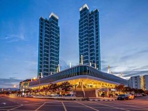 a building with two tall buildings in a city at Maritime Full Seaview Duplex Suites in George Town