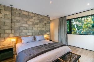 a bedroom with a large bed and a large window at Knysna Tsukamori in Knysna +45 photos