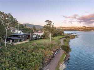 an aerial view of a house next to a body of water at Knysna Tsukamori in Knysna