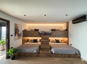 two beds are in a room with at AlFahed Farm in Ajloun
