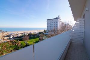 a balcony with a view of the beach at Residence Flow-R in Riccione