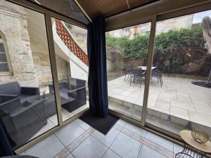 a view of a patio from the window of a house at Résidence Austerlitz centre Angouleme in Angoulême