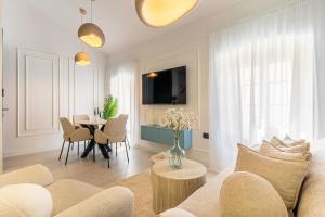 a living room with a couch and a table at Vila Inar Cres in Cres