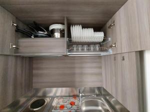 a kitchen with a sink and a counter top at Casa Vacanze Piccolpasso 20 in Urbania +45 photos