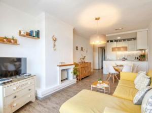 a living room with a couch and a tv at Ideal Property Mallorca - Mas i Reus 10 in Alcudia