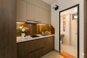a kitchen with a sink and a counter top at Chic & Stylist Studio Lakeview in Hanoi +12 photos