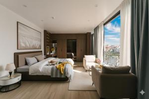 a bedroom with a bed and a large window at Chic & Stylist Studio Lakeview in Hanoi