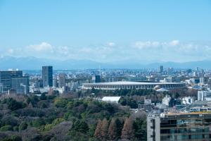 a view of a city with buildings and trees at Toshi Center Hotel in Tokyo