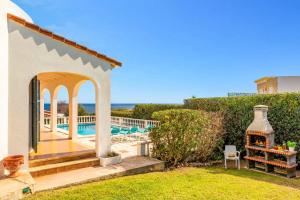 a villa with a pool and a gazebo at Villa Caprice by Villa Plus in S'Algar
