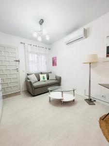 a living room with a couch and a table at Laguna 88 in La Mata