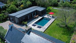 an aerial view of a house with a swimming pool at Villa Koad - piscine privee in Trébeurden