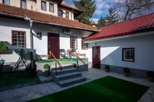 a courtyard with a playground in a house at Bosanska Avlija Authentic Sarajevo Stay with Garden in Sarajevo