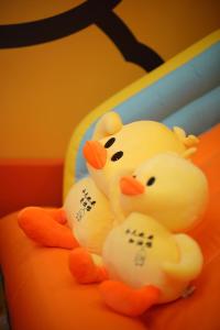 two hello kitty figurines sitting on top of a cake at Naughty Castle Playground & Ball Pool in Johor Bahru