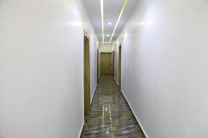 a corridor of an office building with a hallway at Dawn Emeka Hotels in Akwa