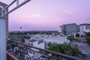 a view of a city from a balcony at Amana Hotel Airport in Ho Chi Minh City +67 photos