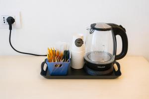 a black coffee maker sitting on a table at Central Dorgali Guest House in Dorgali