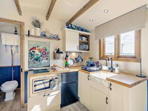 a kitchen with a sink and a toilet at 1 Bed in Cheltenham oc-95422 in Cheltenham