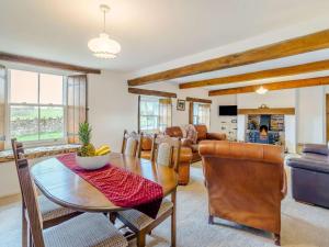 a living room with a table and chairs at 4 Bed in Wigton oc-79563 in Calvo
