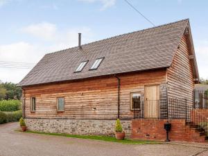 a wooden house with windows on top of it at 3 Bed in Worcester oc-41983 in Broadwas