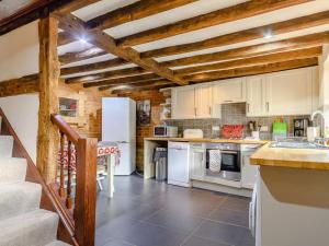 a kitchen with white appliances and wooden ceilings at 2 Bed in Evesham oc-89476 in Bretforton