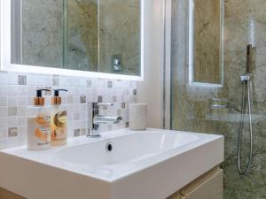 a bathroom with a white sink and a shower at 1 Bed in Gloucester oc-60276 in Tirley +14 photos