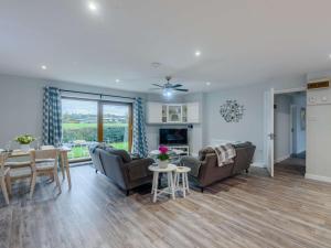 a living room with couches and a dining room at 2 Bed in Northwich oc-85877 in Kingsley