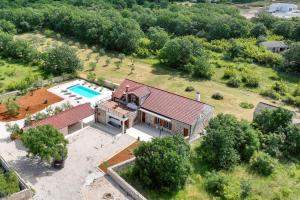 an aerial view of a house with a swimming pool at Demare in Gospić