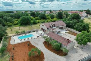 an aerial view of a house with a swimming pool at Demare in Gospić
