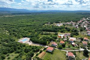 an aerial view of a small village with a resort at Demare in Gospić +67 photos