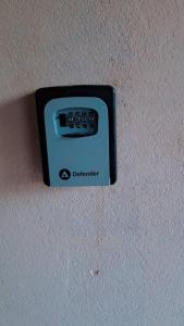 a black electrical outlet on a wall at Secka Apartment in Sukuta