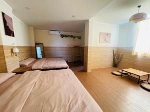 a large room with two beds in it at Homestay 234 Dốc Lết in Ba Ha