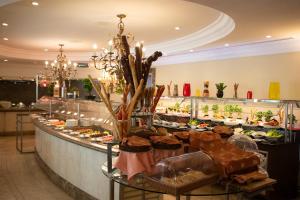 a buffet line with many different types of food at Sheraton Khalidiya Hotel in Abu Dhabi