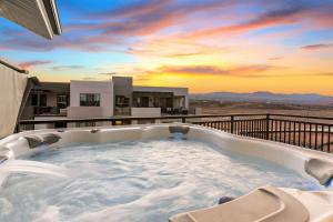 a hot tub on the balcony of a house at The Boardwalk home in St. George
