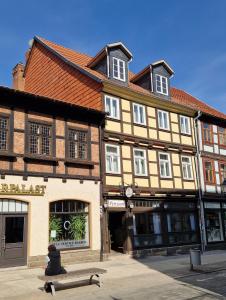 a person sitting on a skateboard in front of a building at Pension Zum Lukullus in Wernigerode