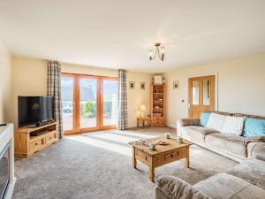 a living room with a couch and a tv at 3 Bed in Berwick-upon-tweed oc-87777 in Lamberton