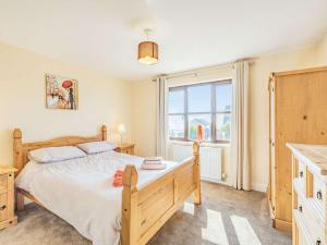 a bedroom with a bed and a large window at 3 Bed in Berwick-upon-tweed oc-87777 in Lamberton