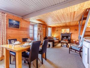 a dining room with a table and chairs in a room at 1 Bed in Gairloch oc-ca044 in Gairloch