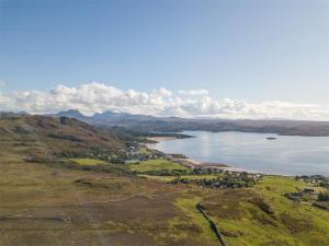 an aerial view of a lake on a hill at 1 Bed in Gairloch oc-ca044 in Gairloch