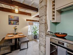 a kitchen with a wooden table and a counter top at 2 Bed in Carnforth oc-90530 in Beetham