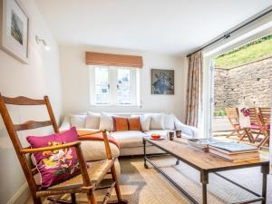 a living room with a couch and a table at 3 Bed in Bath oc-skn21 in Wellow