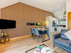 a living room with a table and a kitchen at 2 Bed in Castle Douglas oc-59638 in Castle Douglas +15 photos
