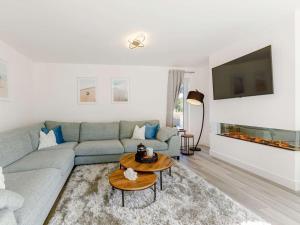 a living room with a couch and a tv at 4 Bed in Holsworthy oc-85673 in Bridgerule
