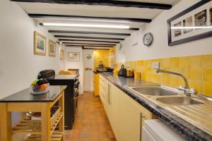 a kitchen with a sink and a counter top at 3 Bed in Brancaster oc-2153 in Brancaster