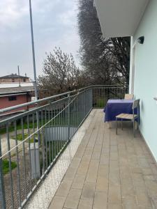 a balcony with a table and a fence at Residence Mariele in Tavazzano